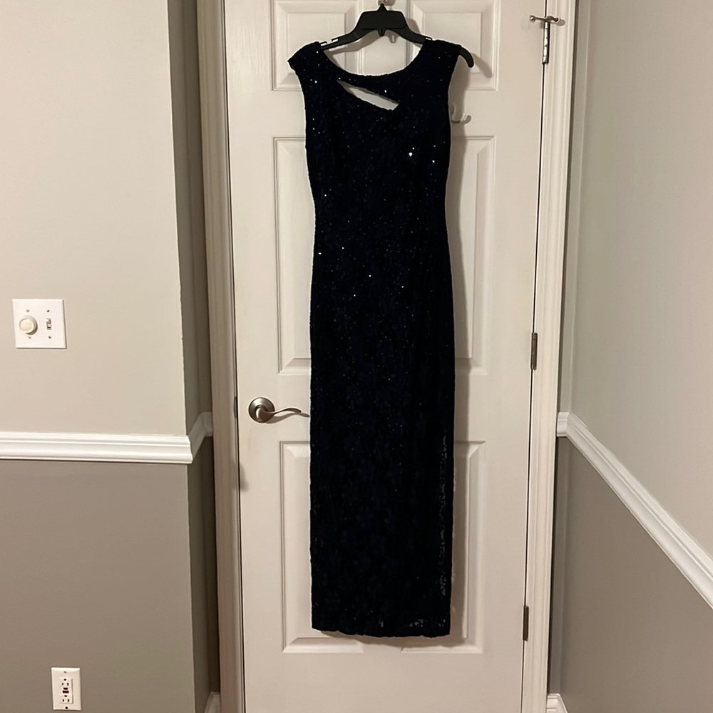 Mother of the bride/groom gown. No rips, tears, snags etc.  color is navy blue